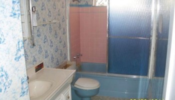 Ugly wallpapered bathroom